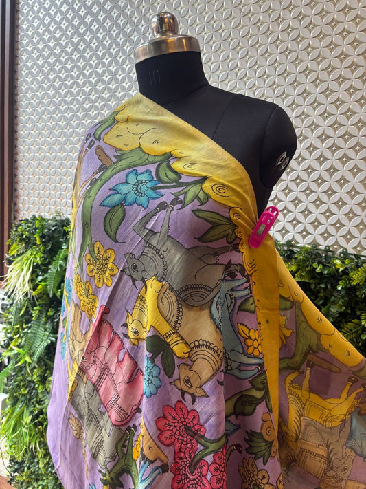 A close-up of the lilac and yellow Kalamkari dupatta draped on a mannequin, highlighting the playful animal and floral motifs.