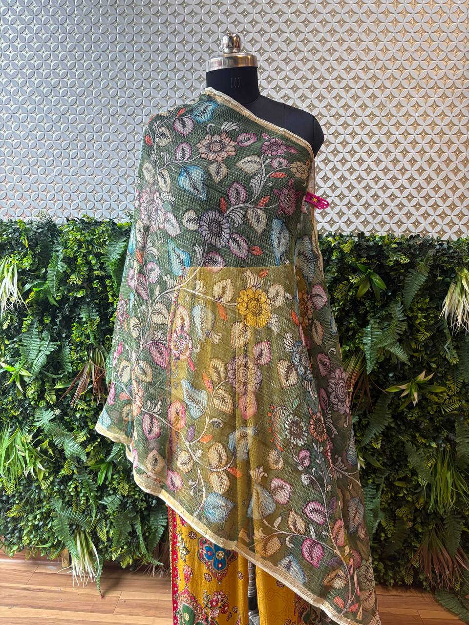Full view of the floral printed Kota Silk dupatta styled on a mannequin with a yellow printed outfit, showing its elegant drape and length.