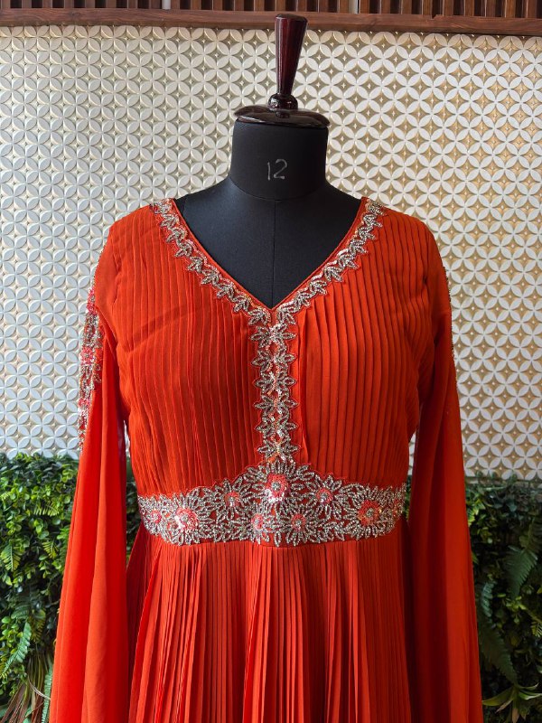 Regal Rust Pleated Gown with Embellished Cape Sleeves by Lable Rosaya