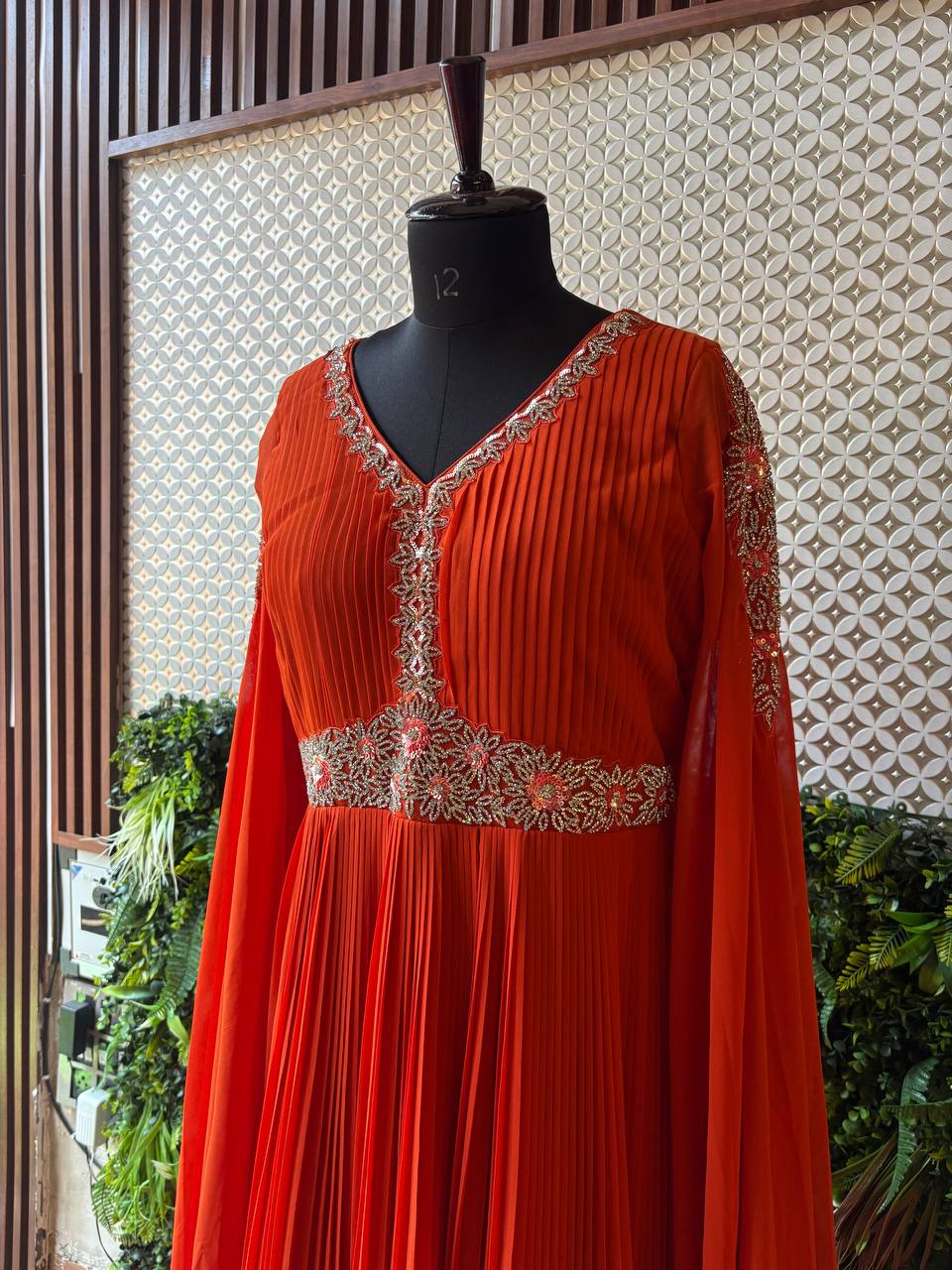 Regal Rust Pleated Gown with Embellished Cape Sleeves by Lable Rosaya