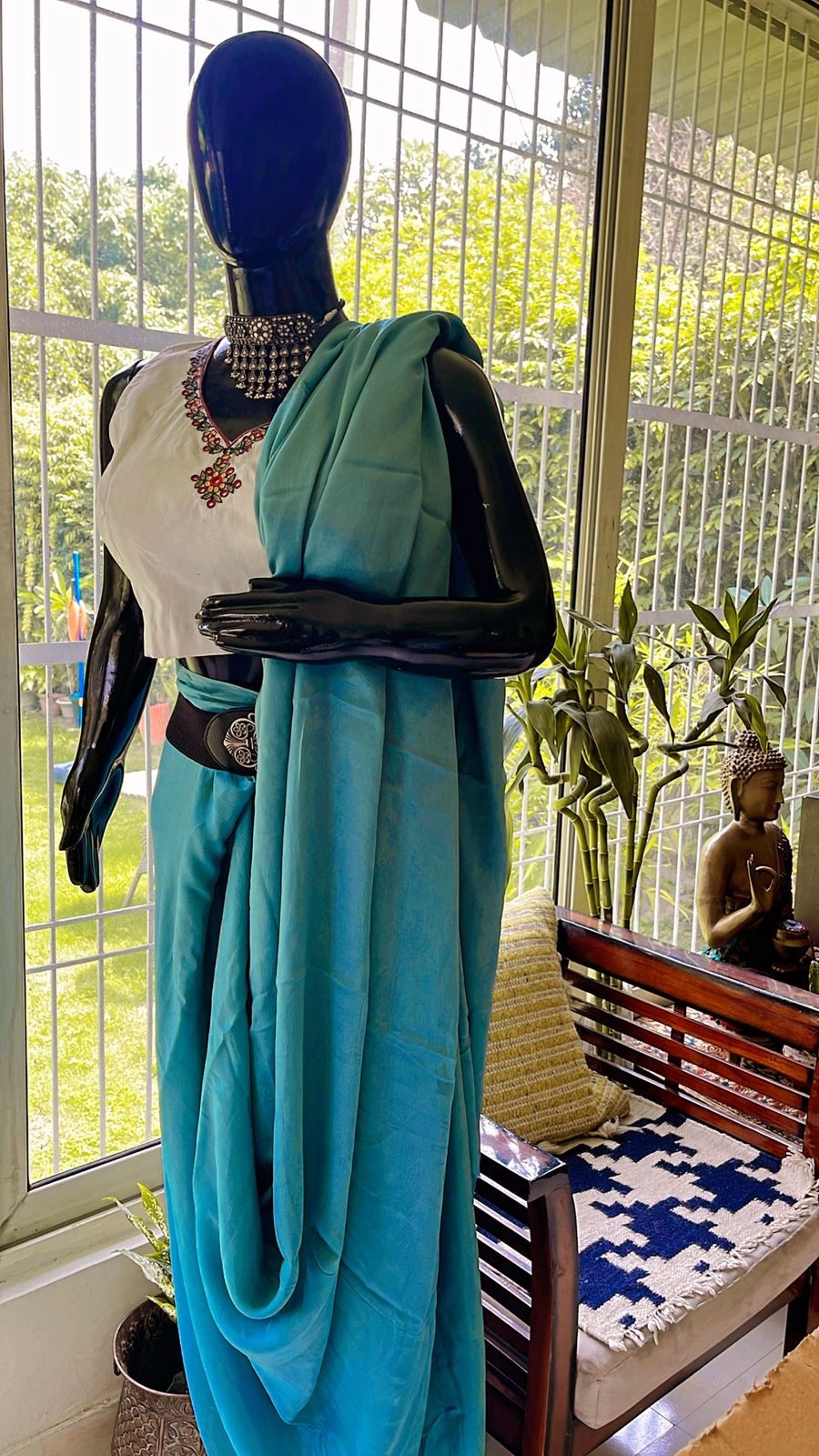 Madhubani handmade embroidery blouse paired with plain Jorzet Saree