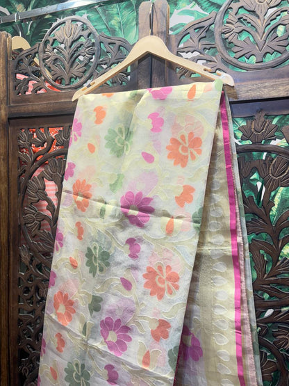Floral-patterned fabric draped over a wooden hanger against an ornate wooden background
