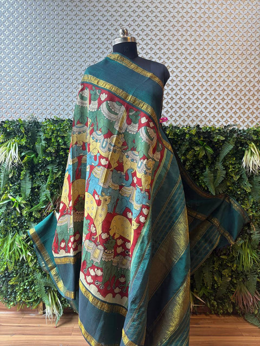 Full view of the Devyani Kanjivaram Kalamkari dupatta draped on a mannequin, showcasing the expansive hand-painted ends with elephant motifs and the rich bottle green silk.