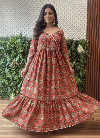 Ajrakh handblock cotton one-piece maxi dress with flared silhouette and lace-trimmed neckline – front view.